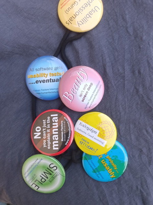 Large colorful pins set of 7 on safety cord, like new