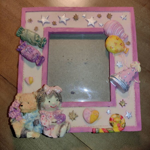 Ceramic table photo frame in pink shades used