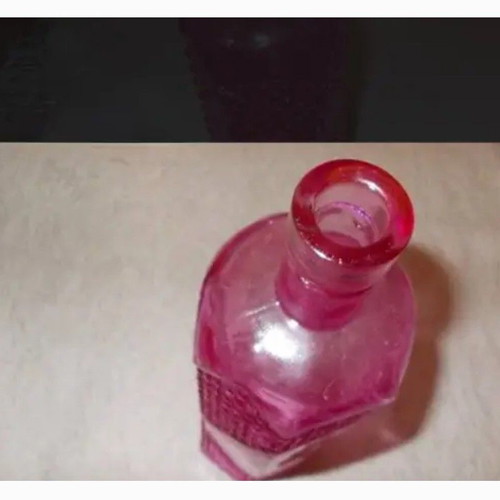 Decorative embossed glass bottle like new, light pink