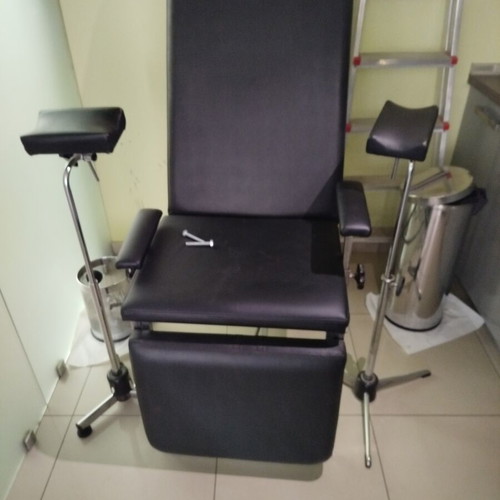 Medical phlebotomy chair used with replaced upholstery