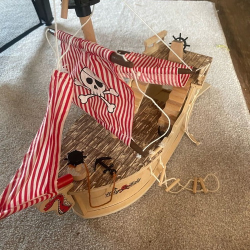 Wooden pirate ship used with small break and marker stains