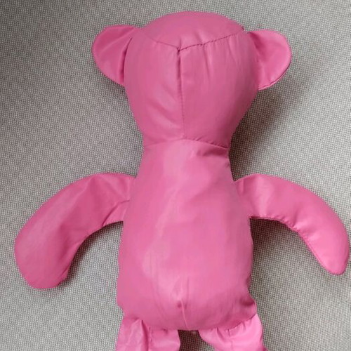 Fuchsia shoulder bag used for shopping with teddy bear pouch
