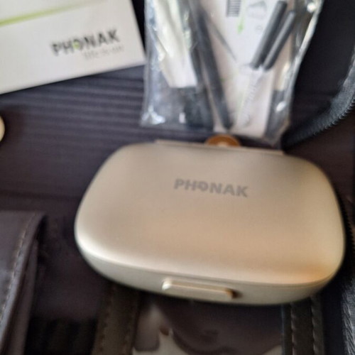 Phonak Audéo V hearing aid with case and cleaning accessories