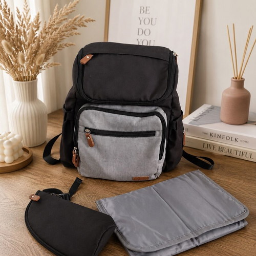 Baby bag with thermos holder and changing mat used