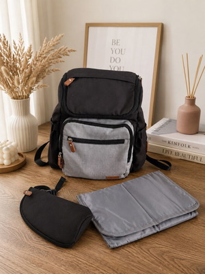Baby bag with thermos holder and changing mat used
