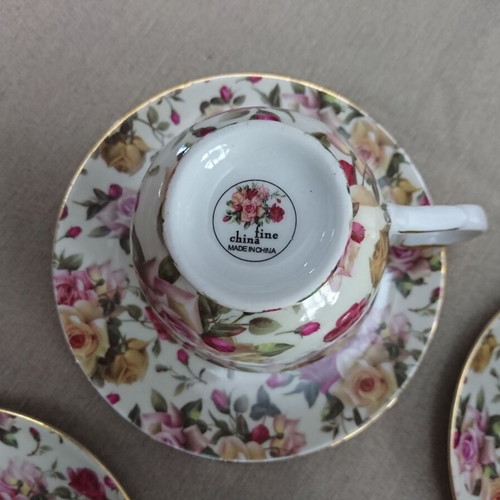 Tea and Coffee Cup Set like new, porcelain with floral pattern