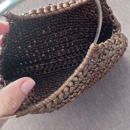 Brown metallic knitted handbag with silver ring handles
