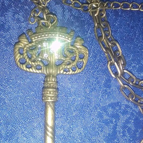 Antique key-shaped pendant like new