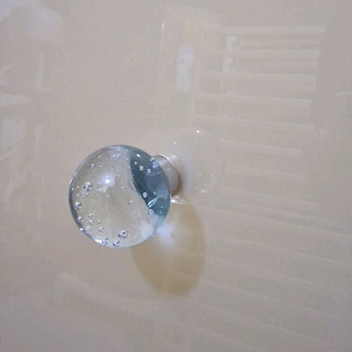 Glass door used with metal hinges and glass knob