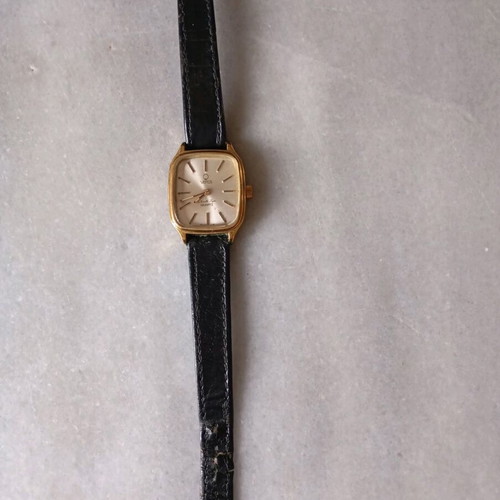 Venus women's watch like new with black leather strap and gold details