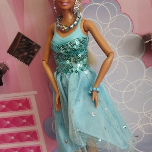 Vintage Barbie doll with handmade shoes and accessories