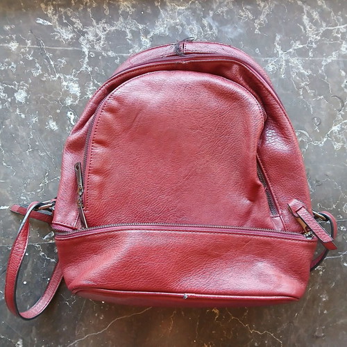 Women's burgundy backpack bag used