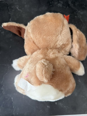 Plush dog with red bows