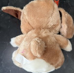 Plush dog with red bows