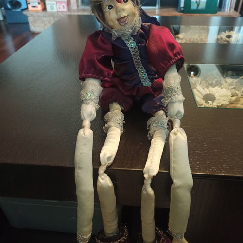 Wind-up Pierrot Harlequin doll used with music
