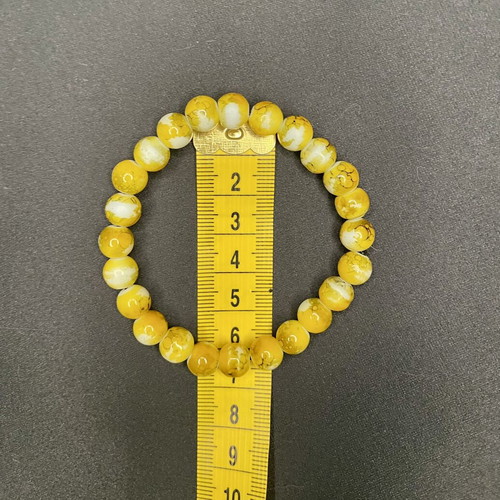 Boho handmade bracelet with yellow crackle beads