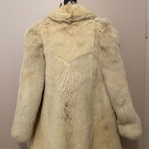 Genuine fur used, ecru with some brown spots