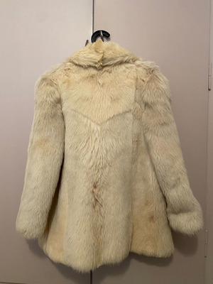 Genuine fur used, ecru with some brown spots