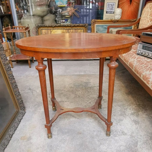 Vintage oval wooden coffee table used with brass feet