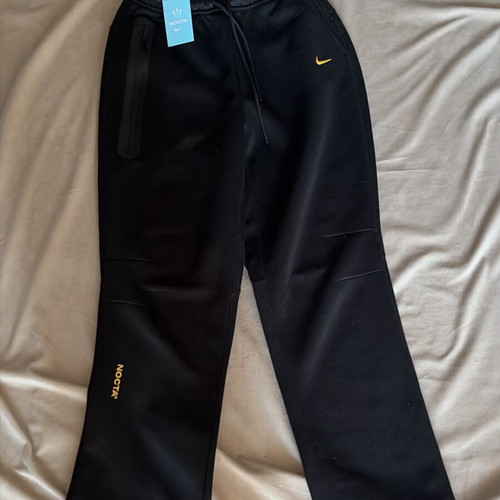 Nike NOCTA sweatpants new, black with yellow details, size M