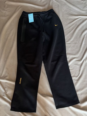 Nike NOCTA sweatpants new, black with yellow details, size M