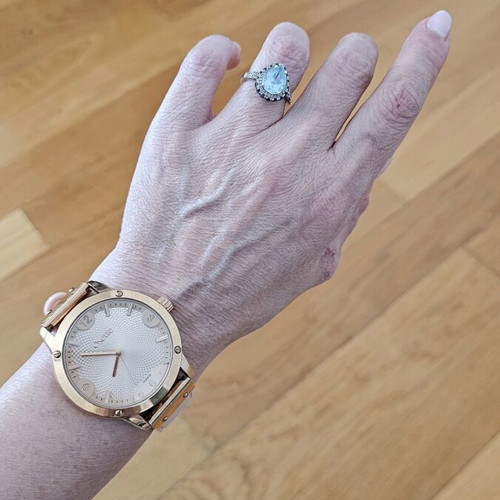 Oxette quartz watch used with bracelet and pink gold ring