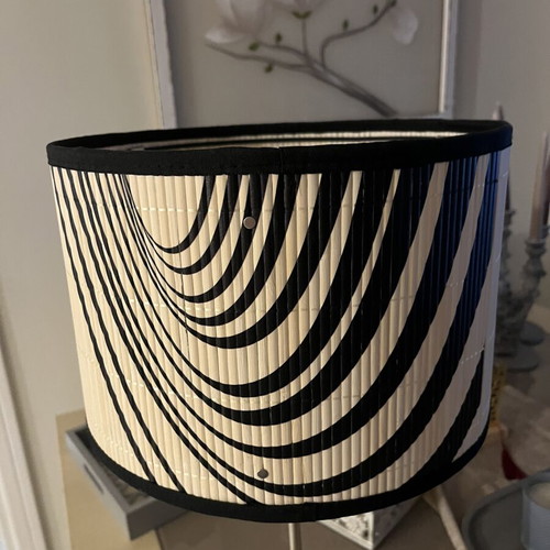 Modern table lamp with black and white geometric shade, optical art