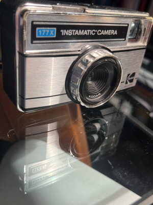 Kodak Instamatic 177X camera used, with Kodar lens and strap