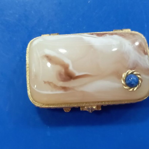 Vintage powder compact used with stone on lid