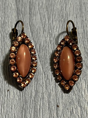 Earrings dangle with pink stones and bronze metal like new
