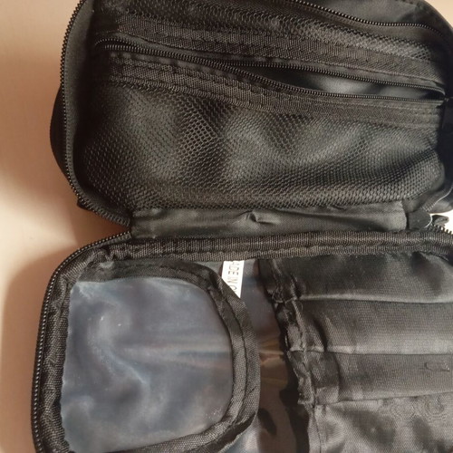 Toiletry bag like new, black, 2 compartments with many slots