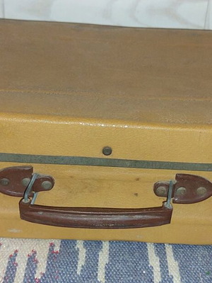 Vintage small suitcase used with wear