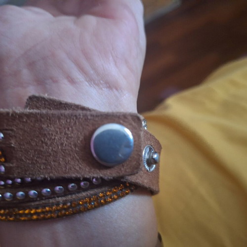 Bracelet with brown, orange, and silver clasp, like new