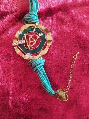 Bohemian handmade bracelet with gold metal pendant, turquoise cord and rhinestones new