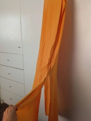 Semi-sheer long orange dress with side slits