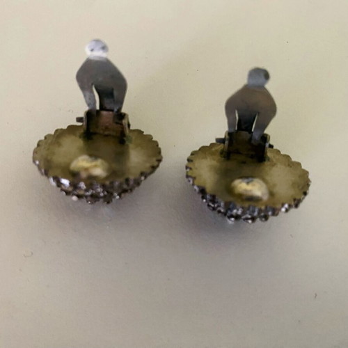 Vintage clip-on earrings with embossed marcasite-style details, used