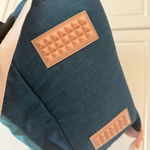 Children's school backpack used with multiple compartments and supportive back