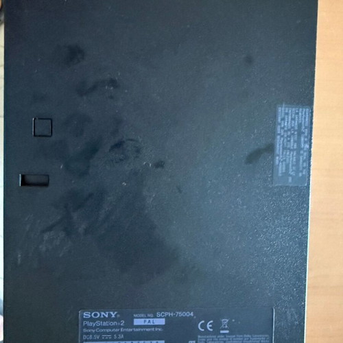 PlayStation 2 Slim console with original Sony accessories
