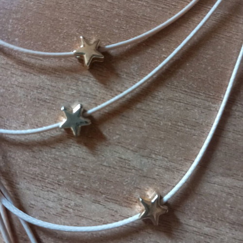Star Necklace with Beige Cord and Multiple Layers Like New