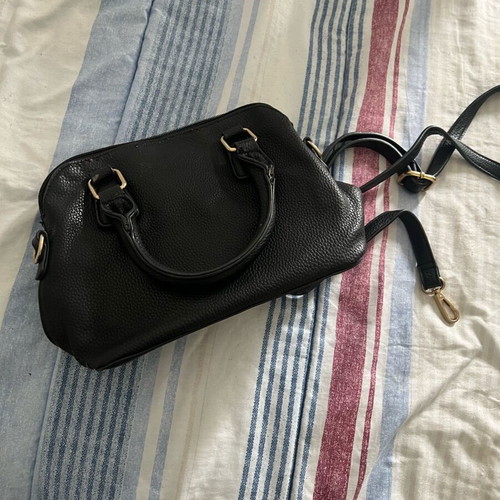Small handbag used with additional strap, black