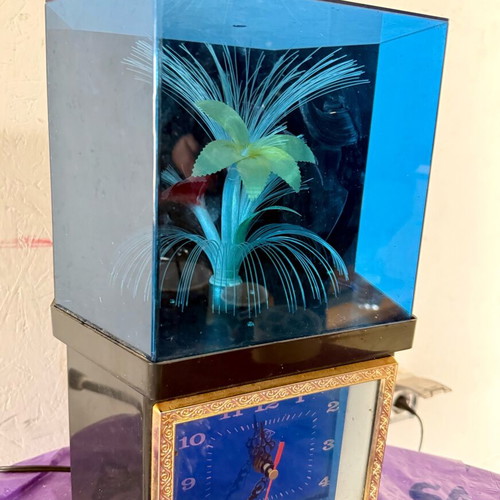 Vintage clock with optical fibers and rotating flower used