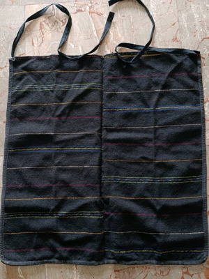 Traditional black apron with stripes used