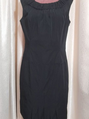 VS black sleeveless dress with round neckline and pleats, size 50