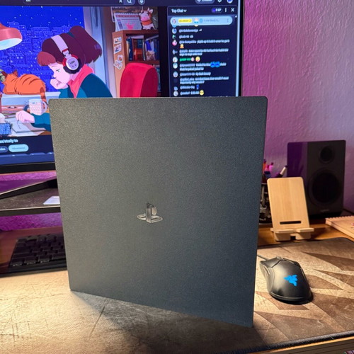 PlayStation 4 Pro used with controller and two games