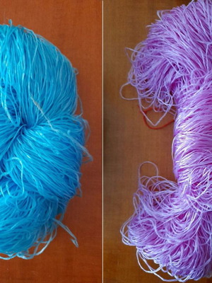 Dolls with straw yarn, one purple and one blue, set of two