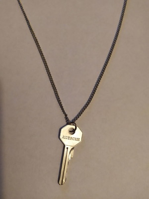 Long necklace with key pendant
