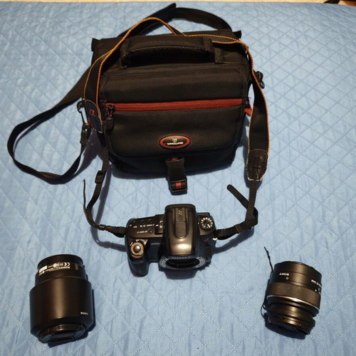 Sony A500 camera used with two lenses, battery, SD card, and carrying case