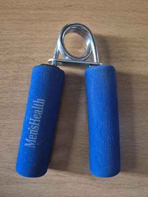 Men'sHealth hand grip strengthener with foam handles and metal spring