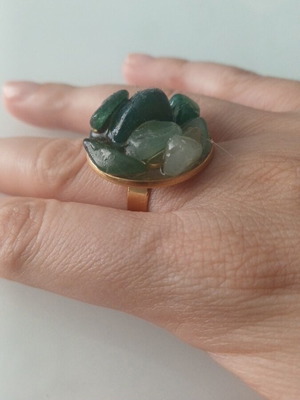 Steel ring in gold tone with green stones like new, adjustable size