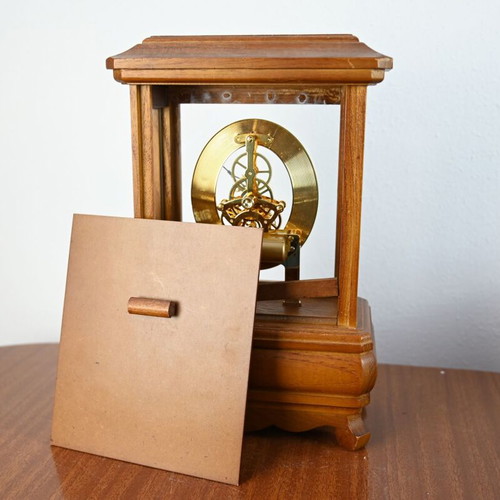 Wooden table clock used with visible skeleton mechanism and drawer